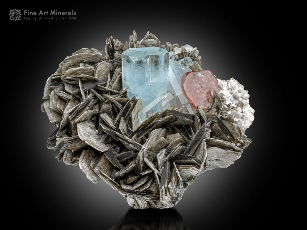 Aquamarine in association with pink Apatite, Muscovite, and Albite.
