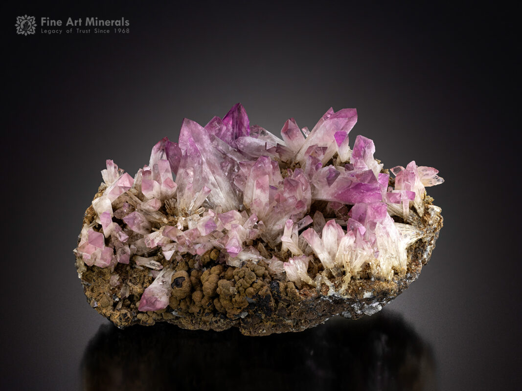 Crystals of Manganoan purple Adamite on a matrix of Manganese Oxides from Durango, Mexico.