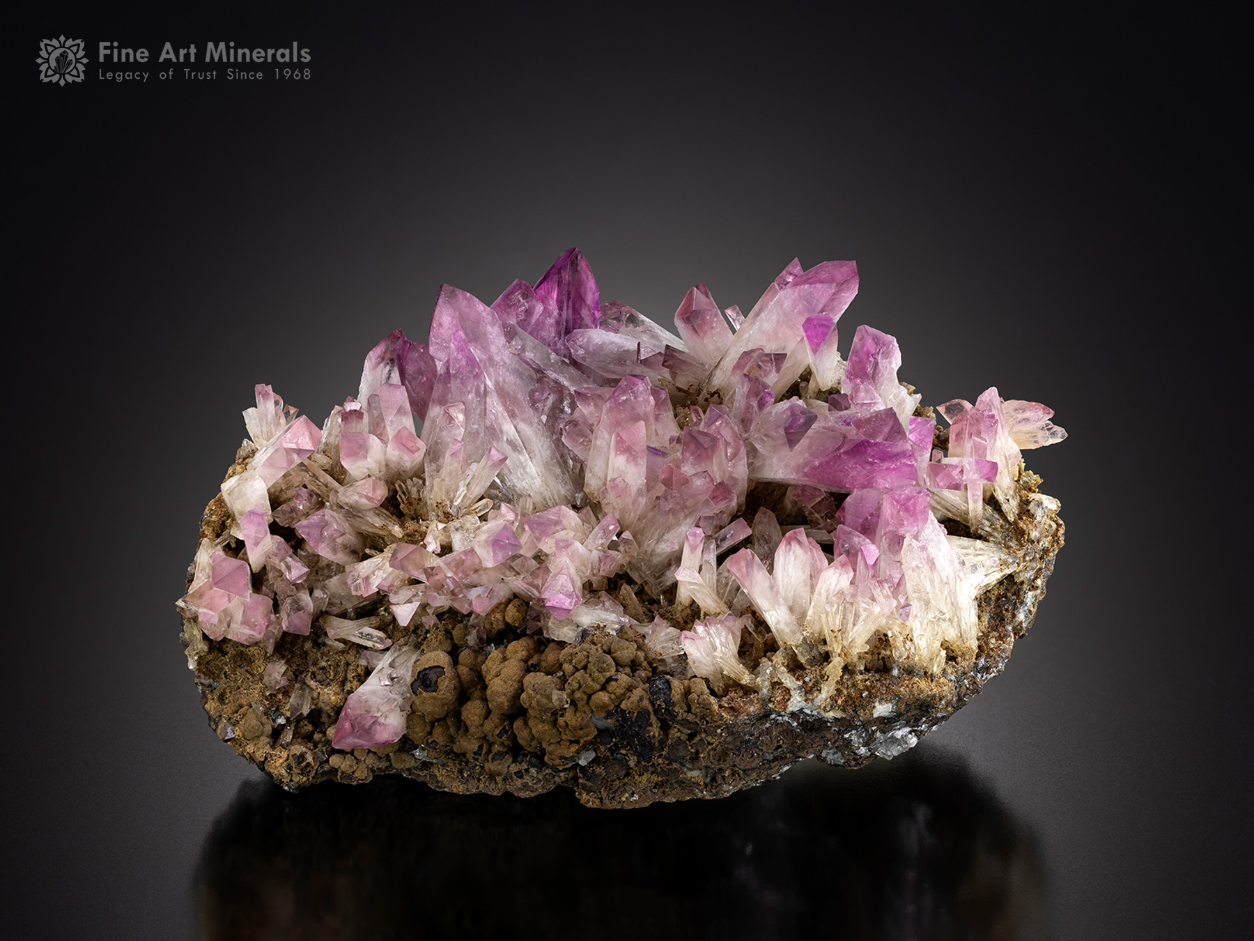 Crystals of Manganoan purple Adamite on a matrix of Manganese Oxides from Durango, Mexico.